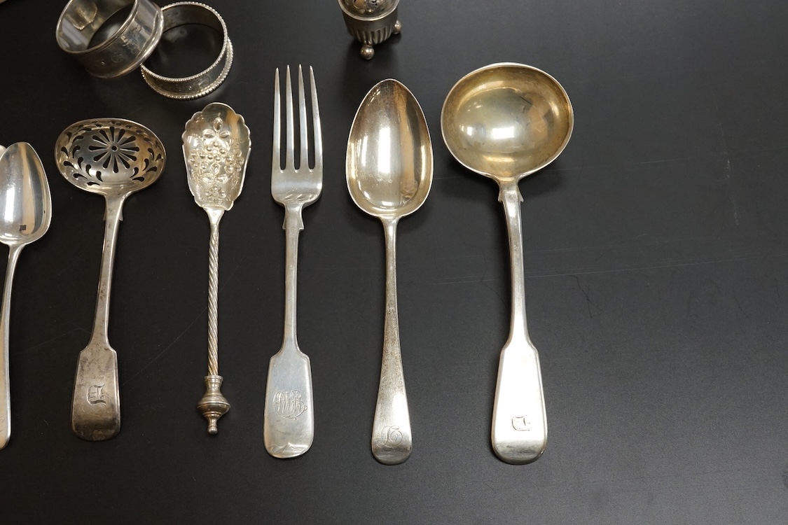 A quantity of assorted mainly 19th century flatware, various patterns, dates and makers including a set of six George III fiddle pattern table spoons by Eley, Fearn & Chawner, London, 1809, six silver fiddle pattern tabl